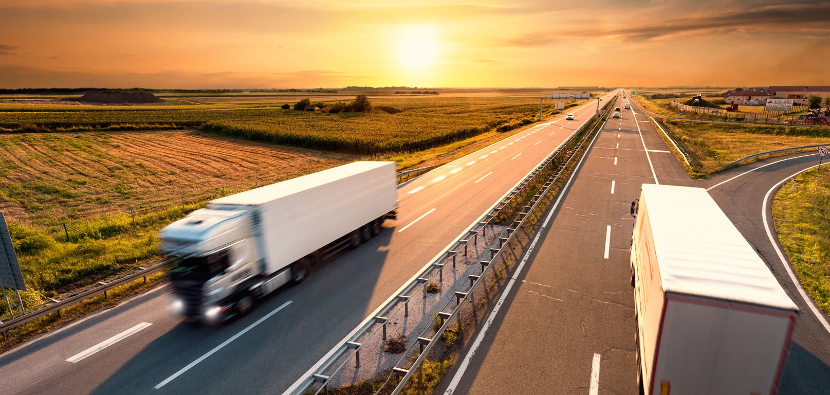 Two trucks on highway in motion blur
